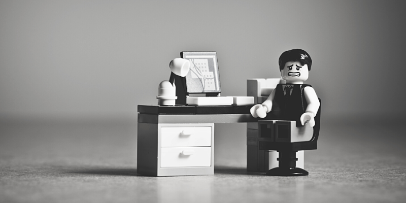 SEO package - lego figure sat at desk looking frustrated
